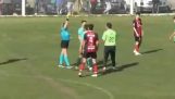 A football player attacks a referee
