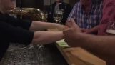 Magic trick with a towel in a bar