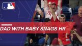 Dad with a baby catches baseball