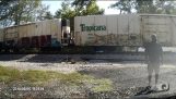A train hits semi-trailer stuck on the railway
