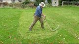 Autumn mowing lawns and meadows with a scythe