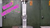 Crushing steel pipes with a hydraulic press