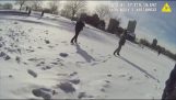 A policeman rescues a man and his dog from a frozen lake (USA)