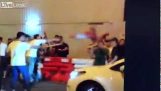 Protestor throws a cone at a man’s head