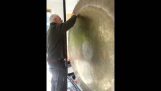 Sound testing a giant golden gong