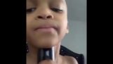 A boy uses his grandmas voice box for creating auto tune music