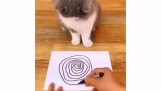 Gato fica tonto com um desenho