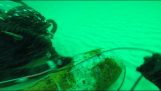Divers detonate an old underwater shell