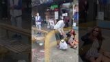 A woman spits on a man on the bus