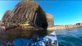 A kayaker explores a stunning Scottish sea cave