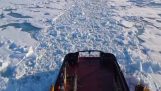 Icebreaker helps a cruise ship cross the ice