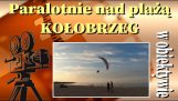 Paraglidisté ​​nad pláží v Kołobrzegu – První máj 2022