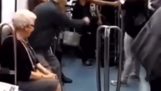 Old couple is invited to dance in the subway
