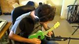 "सुल्तानों का झुकाव" पर एक गिटार का एकल