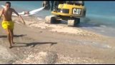 With an excavator at the beach