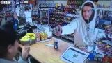 Cashier wrestles with armed robber