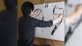 Καλλιτέχνης ζωγραφίζει δύο πορτραίτα ταυτόχρονα