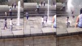 Toddler against fountain
