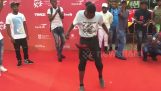 African doing spectacular tricks with a hat