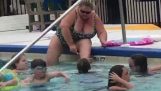 A woman shaves her legs in the pool (Florida)