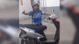 Drunken woman insists to drive the scooter
