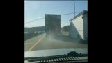 truck tire pops in front of driver