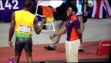 Usain Bolt fist-bumps volunteer
