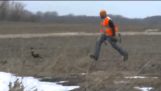 A hunter trying to catch a pheasant