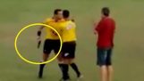 Referee pulls gun during football match