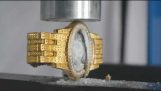 Злато часовници Rolex за $ 20 000 срещу 200 тона хидравлична преса