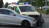 Ambulance collides with car