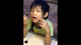 Kid eats Tarantula in Siem Reap, Cambodia