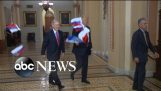 Protester throws Russian flags at President Donald Trump ahead of Capitol Hill lunch