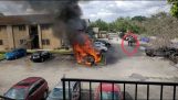 Police rescue a man from a burning car