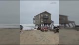 A seaside house collapses into the ocean