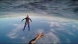 Playing catch with a ball while falling from a plane