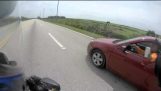 A motorcyclist chased by a motorist