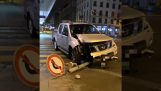A motorist collides with a sign but continues his way