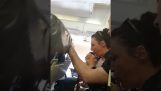 Major turbulence on an airplane launch a stewardess on the ceiling