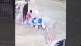 Two children throw their mother in the street