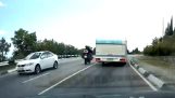 Motorcyclist collides with a car from the oncoming traffic
