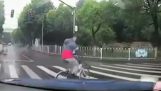 A cyclist takes a ride with another cyclist