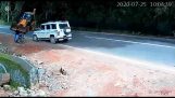 Motorcyclist is saved by an SUV