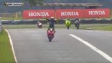 Rider in a motorcycle race is in a hurry to celebrate