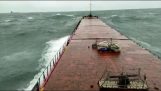 A cargo ship breaks in half before sinking
