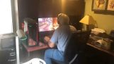 A dad is playing Overwatch on the computer