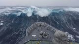 Warship against a huge wave