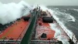 A huge wave hits the deck of the ship