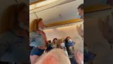 A woman refuses to wear a mask, and is taken out of the plane