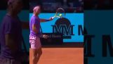 Rafael Nadal spectacularly catches the ball with his racket